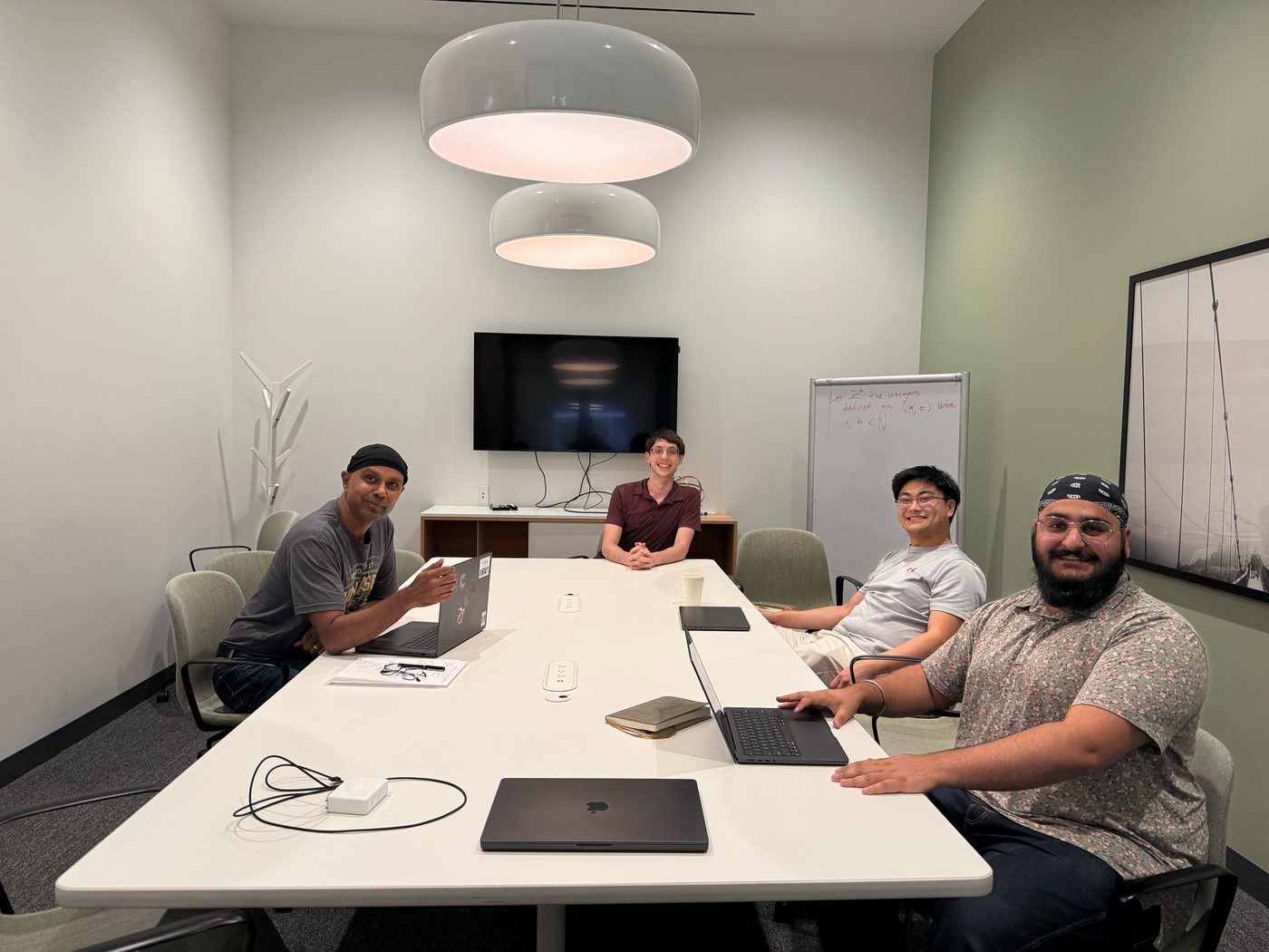 Four of the team working in the meeting room